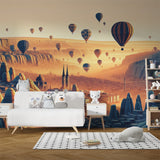 Hot air balloon wallpaper creating a warm, inviting atmosphere in a modern living room with sunset city views