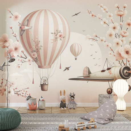 Pink Hot Air Balloon Wallpaper creating a magical atmosphere in a bright nursery with white furniture and soft pink accents