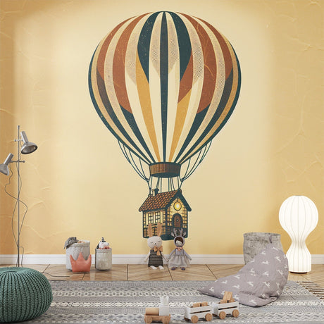 Hot air balloon wallpaper creating a whimsical atmosphere in a bright nursery with natural light and wooden furniture