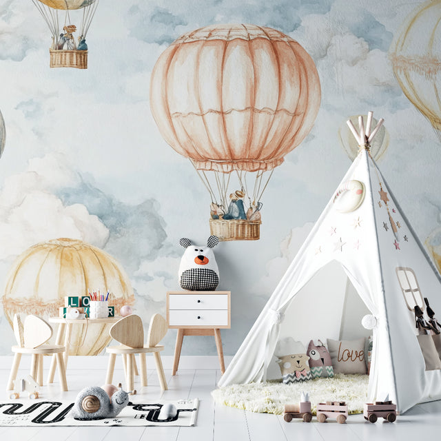 Hot air balloon wallpaper in a bright nursery showing peaceful floating balloons against soft morning sky