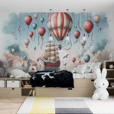Hot air balloon wallpaper creating a dreamy atmosphere in a bright nursery with natural light and wooden furniture