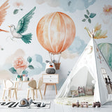 Watercolor balloon wallpaper brightening a child's playroom with natural light