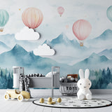 Mountain wallpaper with balloons creating depth in a child's reading nook
