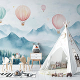 Watercolor balloon mural bringing whimsy to a modern playroom space