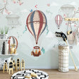 Hot air balloon nursery wallpaper in a cozy white nursery with modern rocking chair and soft lighting