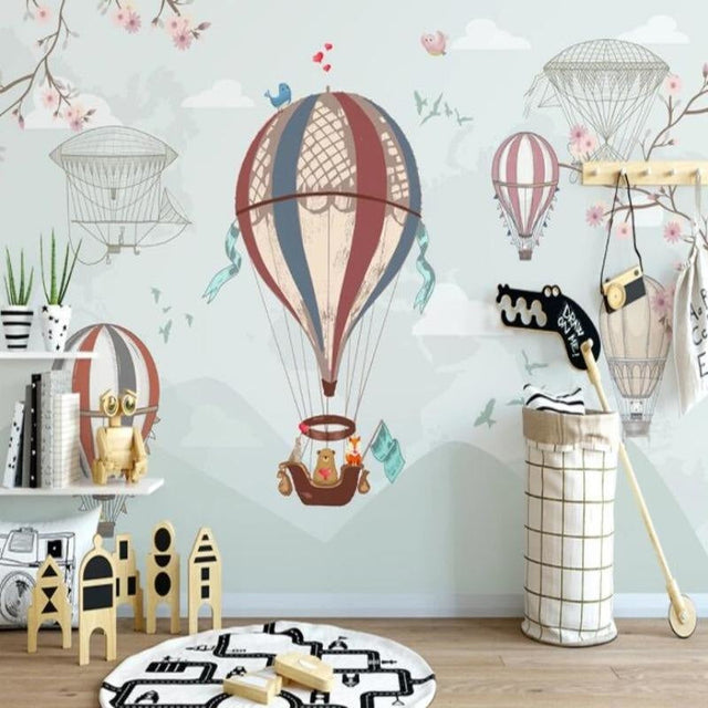 Hot air balloon nursery wallpaper in a cozy white nursery with modern rocking chair and soft lighting