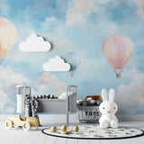 Pastel hot air balloon mural in a cozy reading nook with plush cushions and soft lighting
