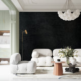 Textured black wall mural in office space with minimalist furniture