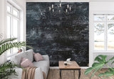 Dark industrial wallpaper creating atmosphere in a creative studio setting