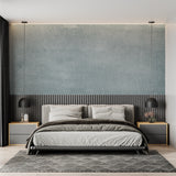 Grey textured concrete wallpaper in bedroom creating calm mood