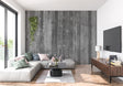 Grey wood plank wallpaper in modern living room with industrial furniture and large windows
