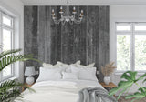 Home office with grey wood effect wallpaper creating a professional backdrop