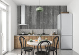 Restaurant interior showcasing industrial grey plank wallpaper with pendant lighting