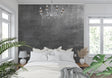 Industrial concrete wallpaper in modern minimalist living room with grey sofa and metal accents