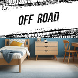 Industrial tire track wallpaper in modern teen bedroom showing bold black and white design