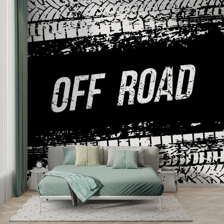 Industrial tire track wallpaper creating bold impact in modern gaming room with black furniture and LED lighting