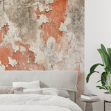 Concrete effect feature wall in minimalist hallway with warm lighting
