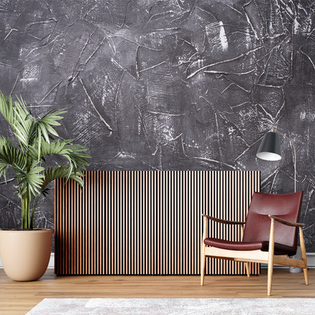 Concrete effect wallpaper in modern minimalist living room showing industrial style and texture