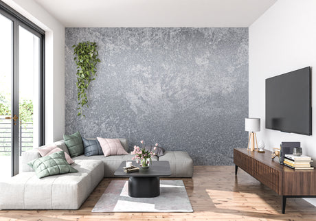Modern grey concrete wallpaper in a minimalist living room with leather sofa and metal accents