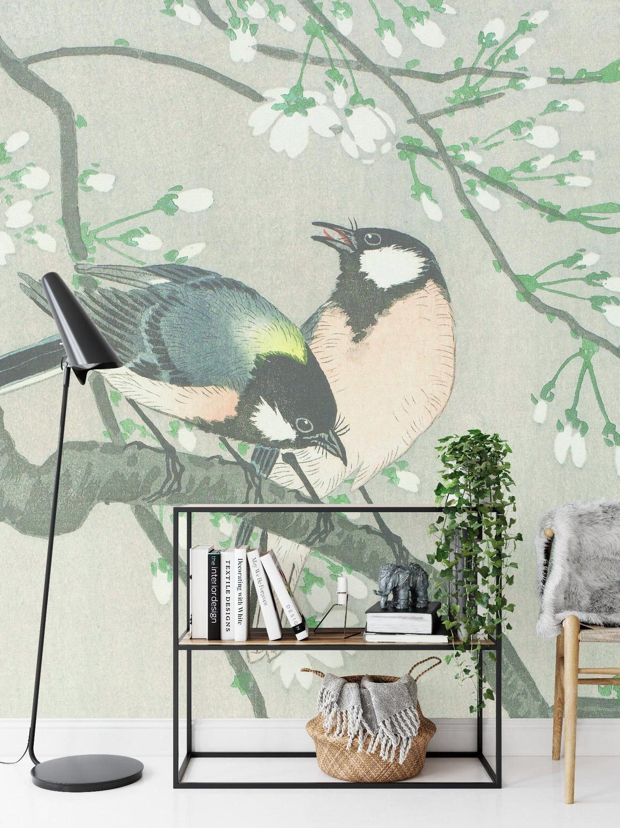 Bird and cherry blossom wallpaper creating calm atmosphere in master bedroom