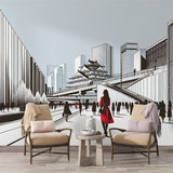 Japanese city wallpaper mural displayed in a minimalist living room with black furniture and red accents