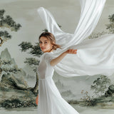 Oriental mountain wallpaper adding depth to a dining room setting