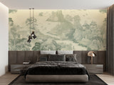 Sage green Japanese landscape wallpaper creating depth in a dining room with wooden furniture