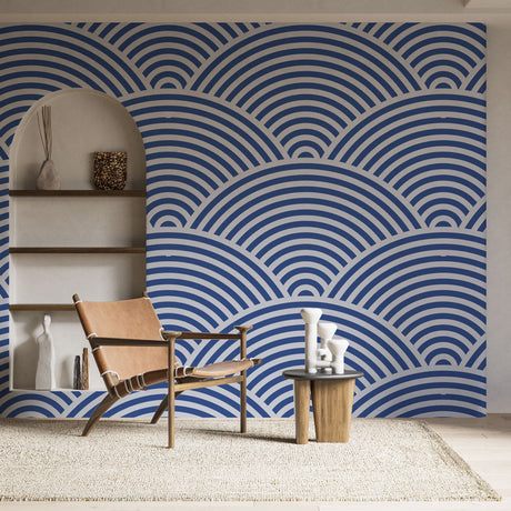Japanese wave pattern wallpaper creating a calming atmosphere in a modern living room with white furniture and natural light