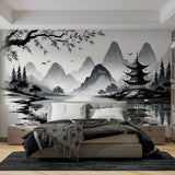 Japanese mountain lake wallpaper creates a peaceful atmosphere in a modern living room, showing the mural's soft misty details