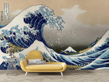 Japanese Wave Mural Wallpaper creating dramatic impact in modern living room, deep blues against light walls