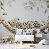 Jungle Animals Wallpaper showing sleeping leopard cub in hammock, styled in a modern nursery with soft green accents
