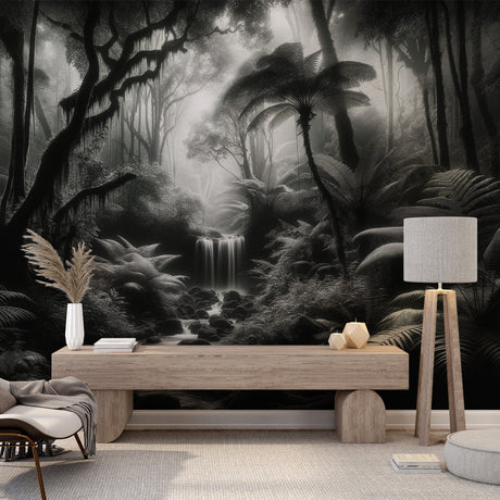 Black and white jungle waterfall mural wallpaper creating a dramatic focal point in a modern living room with minimal furniture