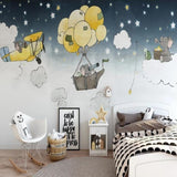 Flying elephants adventure wallpaper in a cozy nursery with a reading nook and soft lighting