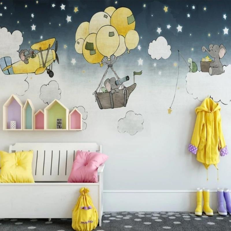Playroom wall with flying elephants mural creating a magical story corner
