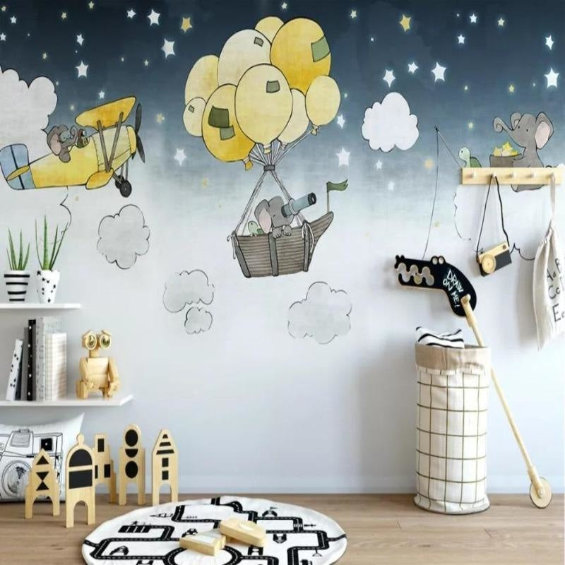 Baby room with elephant adventure wallpaper above a white crib