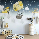 Baby room with elephant adventure wallpaper above a white crib