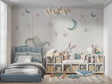 Kids fantasy wallpaper in a cozy nursery with rocking chair and soft lighting