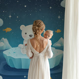 Polar bear wall mural bringing magic to a baby's room with soft blue tones