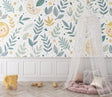 Botanical Moon and Stars Wallpaper in a cozy nursery with soft lighting and natural wood furniture