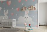 Toddler bedroom with bunny wallpaper showing playful reading nook and toy storage