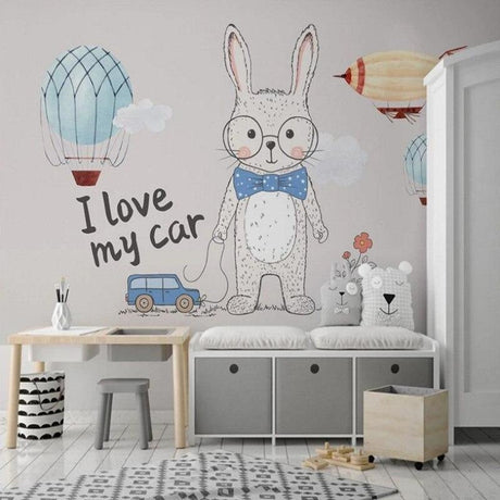 Nursery wall mural with bunny and hot air balloons creating a cozy atmosphere in a modern nursery room