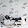Transport wallpaper in modern nursery with rocking chair and soft lighting showing cars and helicopters pattern
