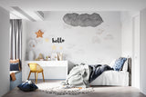 Cars and helicopters wallpaper in playroom setting with reading nook and storage