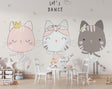 Dancing cats ballet wallpaper in a bright nursery with white furniture