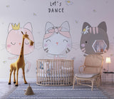 Dancing cats wall mural in a cozy bedroom corner