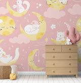 Kids bedroom featuring dreamy cat wallpaper with moons and stars, showing peaceful bedtime setting