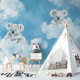 Close-up of koala wallpaper detail in a reading nook, highlighting the gentle color palette