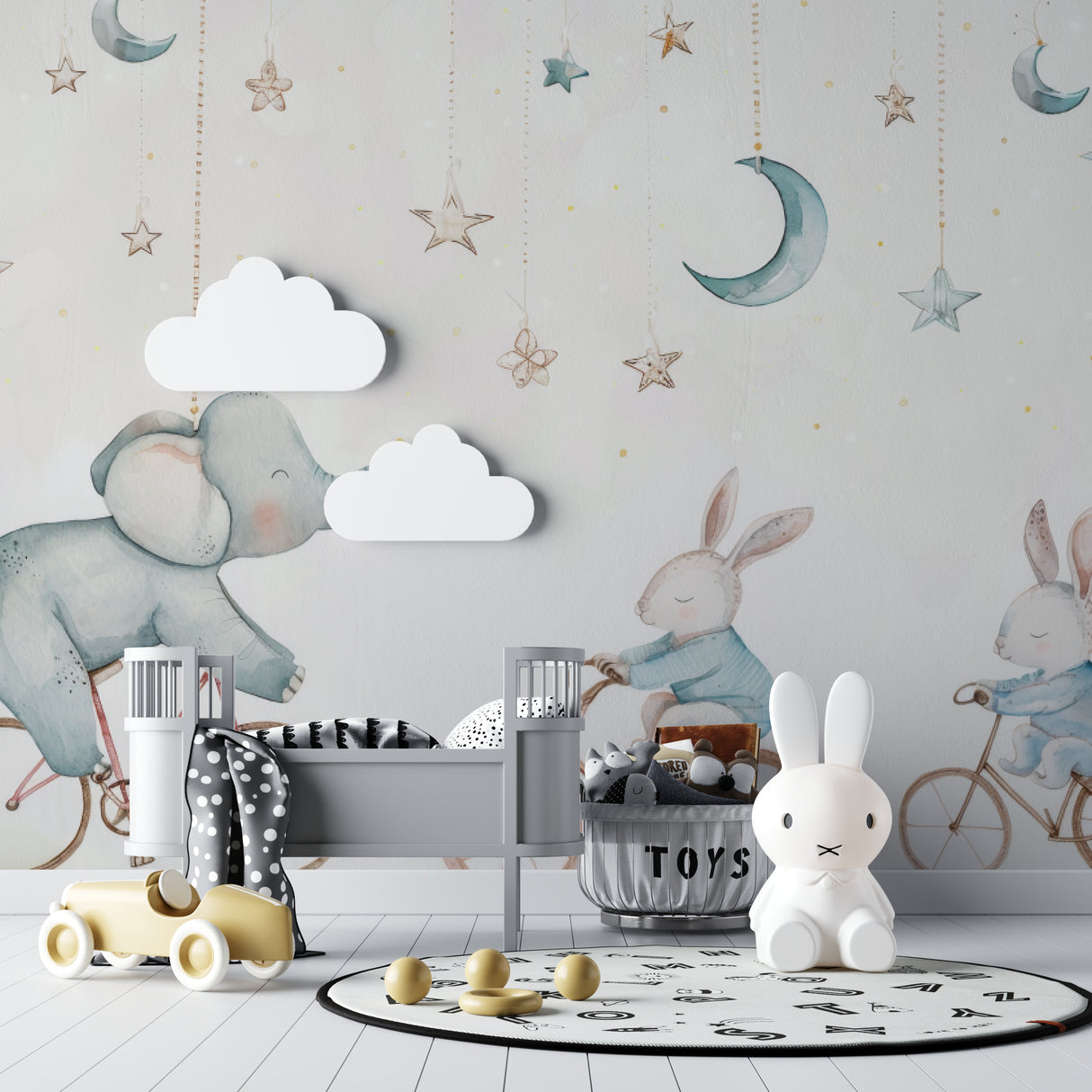 Nursery wallpaper with elephant and bunnies in a cozy modern nursery with white furniture and soft lighting