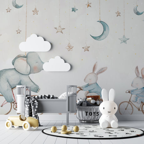 Nursery wallpaper with elephant and bunnies in a cozy modern nursery with white furniture and soft lighting