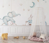 Shared kids bedroom with elephant and bunny mural creating a dreamy atmosphere